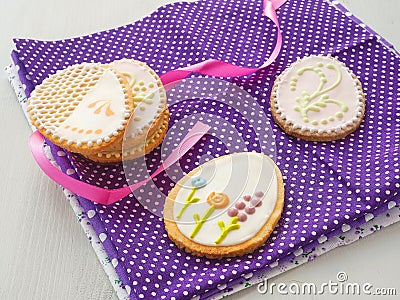 Beautiful biscuits in the shape of easter egg. Easter sugar cookies with floral ornament. Stock Photo