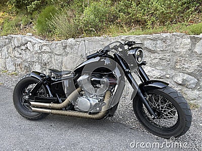 Beautiful black custom motorcycle parked Stock Photo