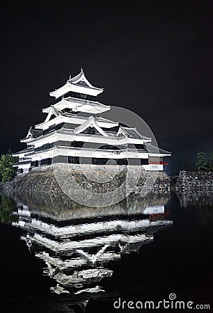 Beautiful black and white of Matsumoto castle with bright light at night Editorial Stock Photo