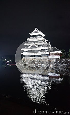Beautiful black and white of Matsumoto castle with bright light at night Editorial Stock Photo