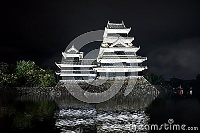 Beautiful black and white of Matsumoto castle with bright light at night Stock Photo
