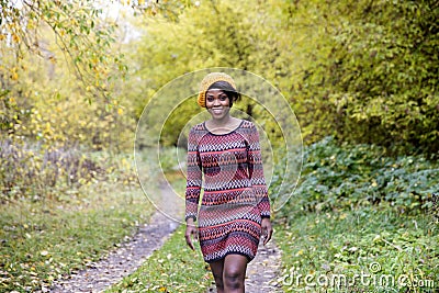 Beautiful black woman in outside photo shoot at fall Stock Photo