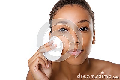 Beautiful black woman removing make up Stock Photo