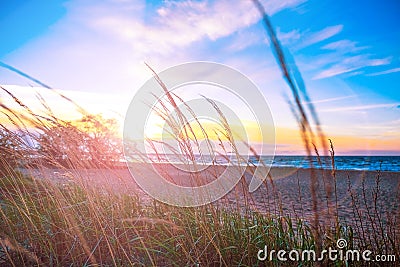 Beautiful blazing scenery of the sunset over the sea and the orange sky above him with amazing Golden reflection of the sun on the Stock Photo