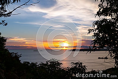 Beautiful blazing sunset landscape at black sea and orange blue sky Stock Photo