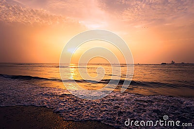 Beautiful blazing sunset landscape at black sea and orange sky Stock Photo