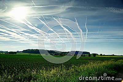 Beautiful bleu sky with white lines of aeroplanes Stock Photo