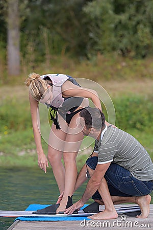 beautiful blond active woman learning to waterskiing Stock Photo