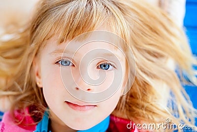 Beautiful blond blue eyes girl lying Stock Photo