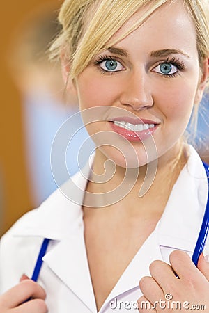 Beautiful Blond Female Nurse With Blue Eyes Stock Photo