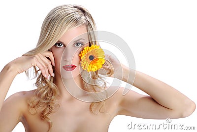 Beautiful blond girl with gerber daisy flower on a white Stock Photo