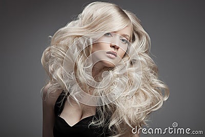 Beautiful Blond Woman. Curly Long Hair Stock Photo