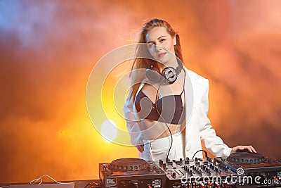 Beautiful blonde DJ girl on decks - the party Stock Photo
