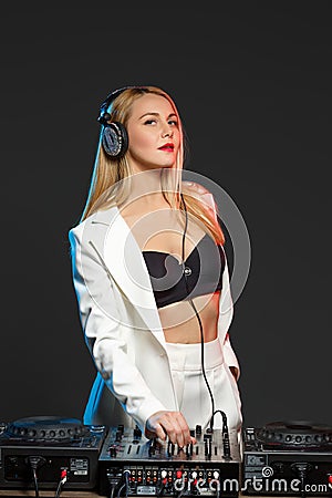 Beautiful blonde DJ girl on decks - the party Stock Photo