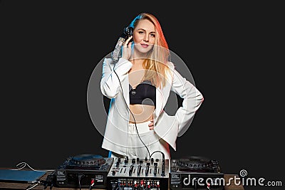 Beautiful blonde DJ girl on decks - the party Stock Photo