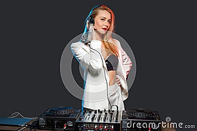 Beautiful blonde DJ girl on decks - the party Stock Photo