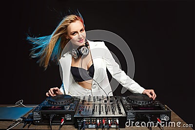 Beautiful blonde DJ girl on decks - the party Stock Photo