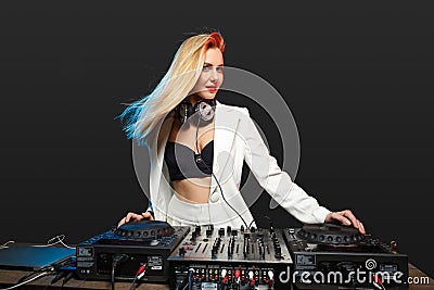 Beautiful blonde DJ girl on decks - the party Stock Photo