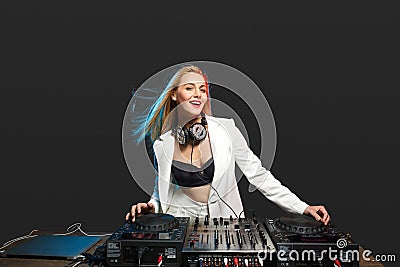 Beautiful blonde DJ girl on decks - the party Stock Photo