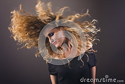 Beautiful blonde girl dancing Stock Photo