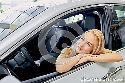 Beautiful blonde girl dream about this car Stock Photo