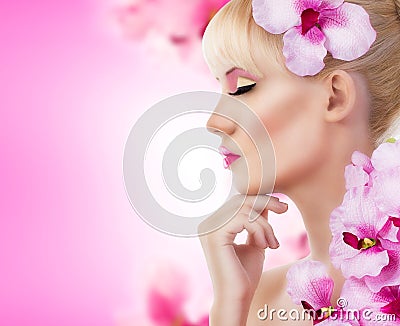 Beautiful girl with flowers and perfect makeup Stock Photo