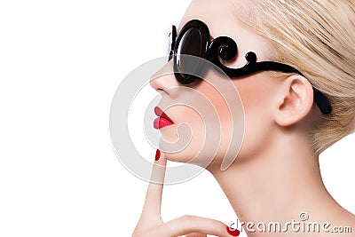 Beautiful blonde girl in sunglasses with red lips on white background Stock Photo