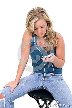 Beautiful Blonde Teen Girl Listening to Ipod Stock Photo