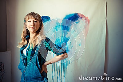 Beautiful blonde woman painter Stock Photo