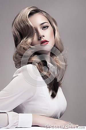 Beautiful Blonde Woman. Retro Fashion Image. Stock Photo