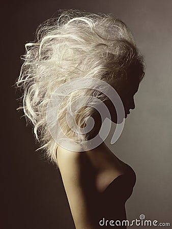 Beautiful blonde woman with volume hairstyle Stock Photo