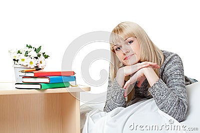 Beautiful blondie near books Stock Photo