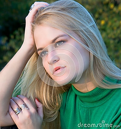 Beautiful blondy woman posing on autumn Stock Photo