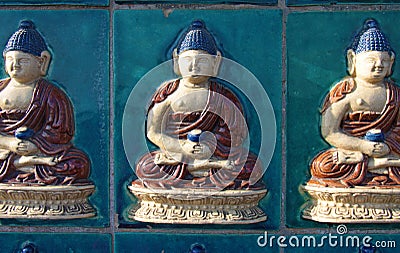 Photo taken in China. A beautiful blue Buddha is made of ceramic Stock Photo
