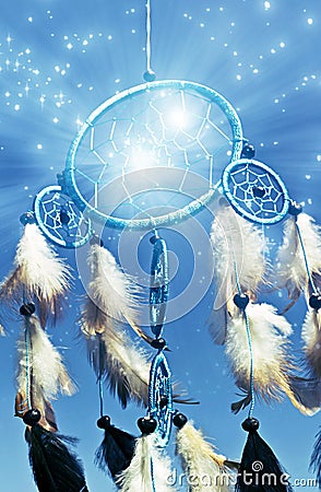 Beautiful blue dreamcatcher with feathers and stars Stock Photo