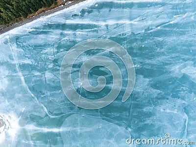 Beautiful blue frozen crystal clean lake aerial drone view Stock Photo