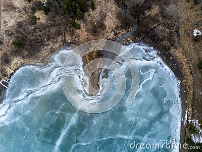 Beautiful blue frozen crystal clean lakeshore aerial drone view Stock Photo