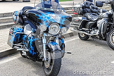 Beautiful blue Harley Davidson motorcycle parked on display on a road Editorial Stock Photo