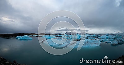 Beautiful blue icebergs float over water at Jokulsarlon glacier lagoon Iceland Stock Photo