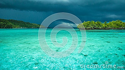 Beautiful Blue Lagoone shortly before Thunderstorm, Gam Island, West Papuan, Raja Ampat, Indonesia Stock Photo
