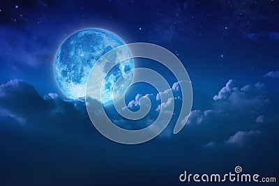 Beautiful blue moon behind cloudy on sky and star at night. Outdoors at night. Full lunar shine moonlight over cloud at nighttime Stock Photo