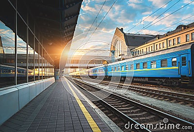 Beautiful blue passenger train at the railway station Stock Photo