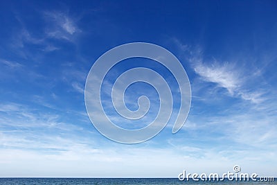 Beautiful blue sky with cirrus clouds over the sea. Skyline Stock Photo