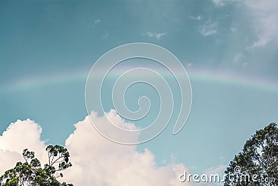 Beautiful blue sky with rainbow Stock Photo