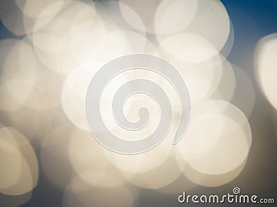 Beautiful blurred bokeh light yellow on a blue background. Christmas concept Stock Photo
