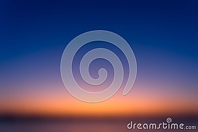 Beautiful blurred sky before sunrise with natural gradient of orange and blue sky background Stock Photo