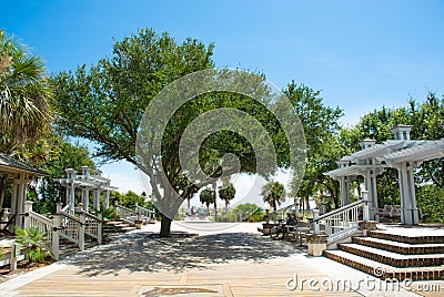 Beautiful boardwalk with rewws by the beach. Stock Photo