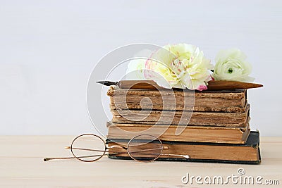 Beautiful bouquet of flowers on the old books Stock Photo