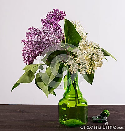 A beautiful bouquet in a vase. A bouquet of lilac branches in a beautiful jar. Stock Photo