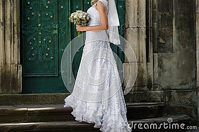 Beautiful bride with big wedding bouquet Stock Photo